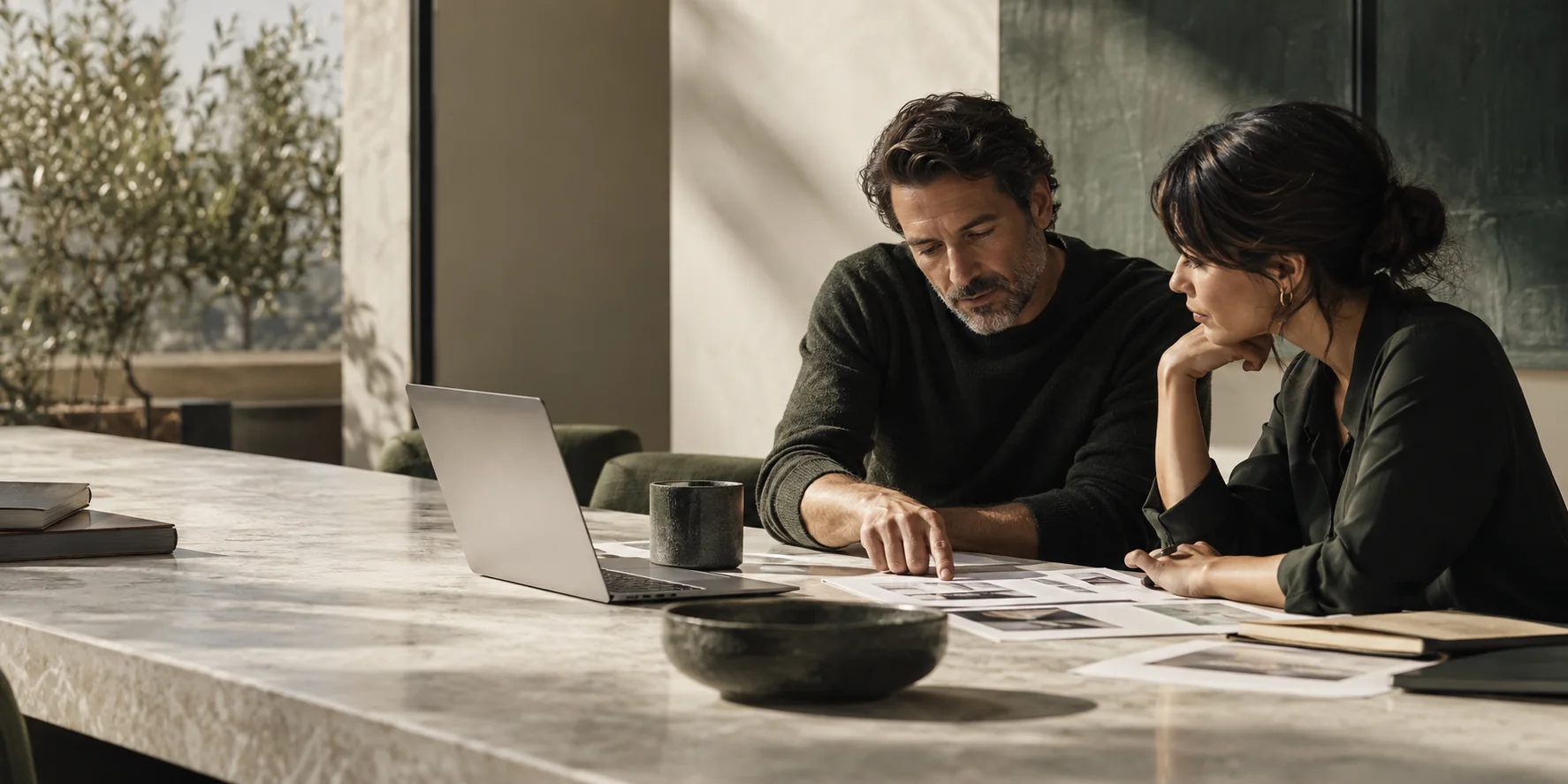 Two colleagues reviewing a decision together at a table